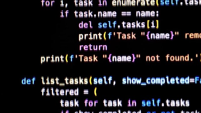 Programmer Working With Python Code and AI Development on Computer