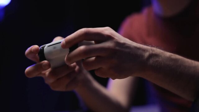 Gamer Playing Video Games With Wireless Controller on TV