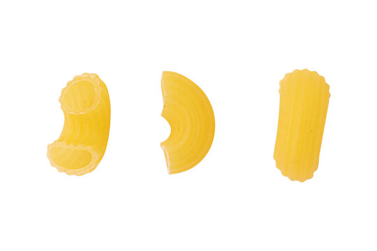 three pieces of uncooked chifferi rigati elbow pasta isolated on white background, traditional italian pasta made from durum wheat, mock-up of culinary ingredients layout