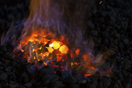 A blacksmith forging, working at the Ehnert forge in Dresden-B&uuml;hlau, Saxony, Germany