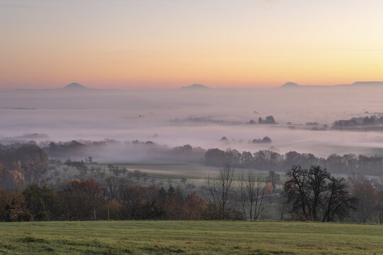 Three Kaiserberge mountains in golden morning light, Hohenstaufen, Aichelberg. Spectacular dawn over the foggy foothills of Baden-W&uuml;rttemberg