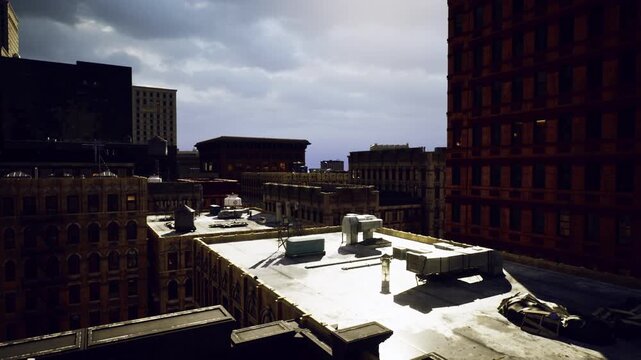 Sunwashed rooftop machinery and vents with warm highlights, industrial textures and service access points visible, quiet urban rooftop scene suggesting routine