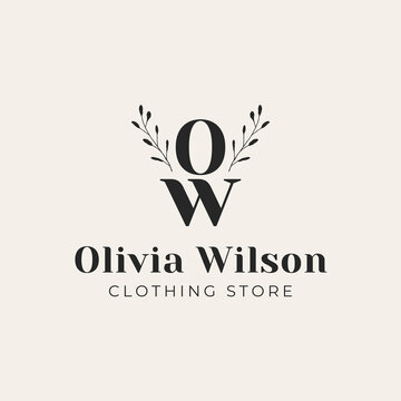 Elegant monogram logo for olivia wilson clothing store featuring serif initials o and w with delicate botanical branch accents professional fashion boutique branding design on beige background paper.