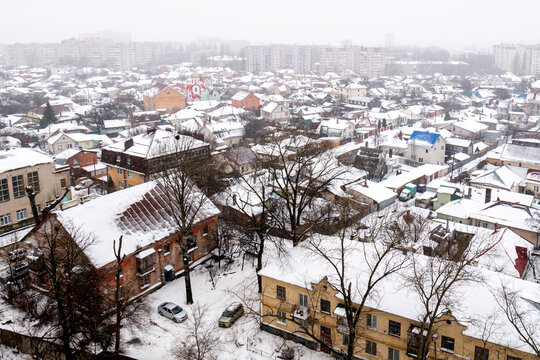 Voronezh, Russia, January 3, 2026: Winter residential area of ​​Voronezh with private sector and multi-story buildings, view from above