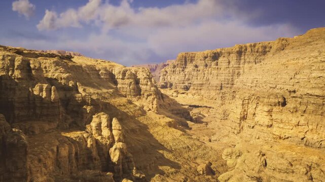 Layered canyon wall showing geological strata and weathered surfaces, sunlit ridges and deep crevices, textured sediment bands, ideal for science and education.