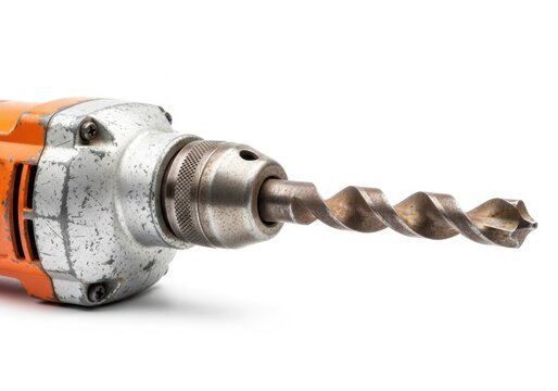 Closeup of a worn orange and silver drill with a large metal drill bit attached isolated on white background