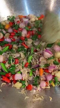 Spice Mix with Colorful Chilies Shallots Green Beans and Dried Shrimp in Metal Bowl with Static Overhead Shot