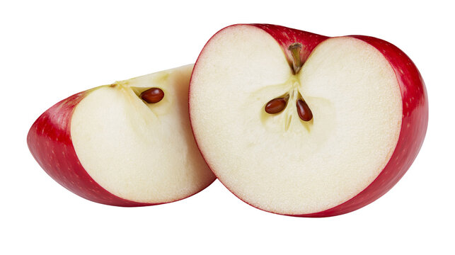 Red apple cut in half showing seeds and white flesh