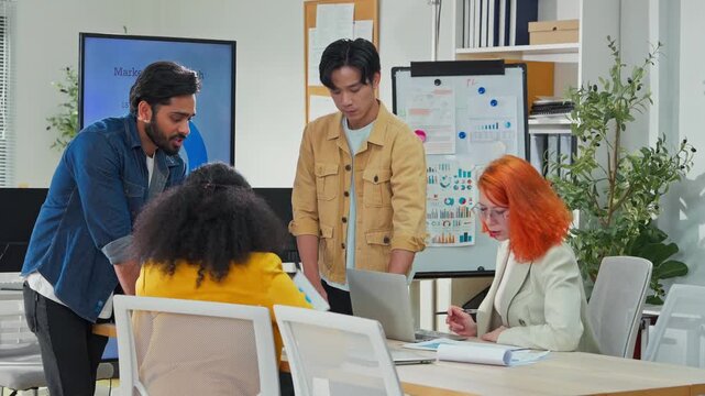 Diverse multiracial business team brainstorming in open modern office using AI bot to analyze and summarize client data, focused analysts presenting strategic plan, future of work concept