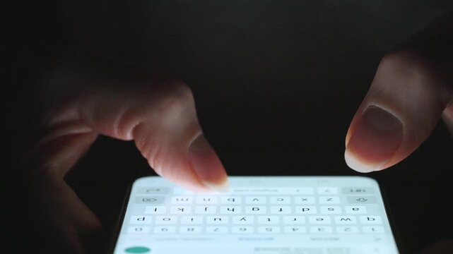 Female hands typing text on smartphone close-up.