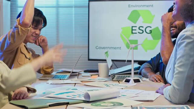 Diverse multiracial business team sitting in night office presenting ESG restructuring plan for clean energy profit growth, corporate consulting analysts strategy meeting concept