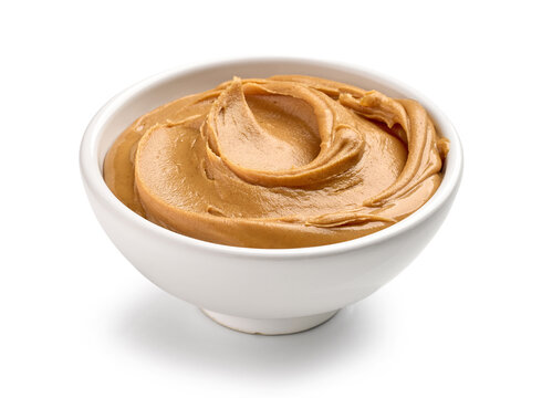 bowl of peanut butter isolated on white background