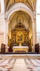 Obraz premium Grand gothic cathedral interior with ornate altar and pews.