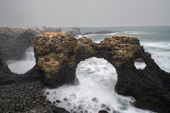 Gatklettur sea arch with crashing waves on Snaefellsnes peninsula, Iceland