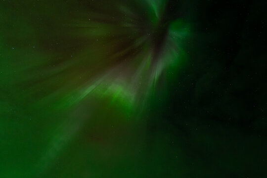 Abstract green northern lights with stars in Icelandic night sky
