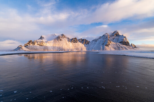 Vestrahorn mountain at sunrise above black sand beach, Iceland