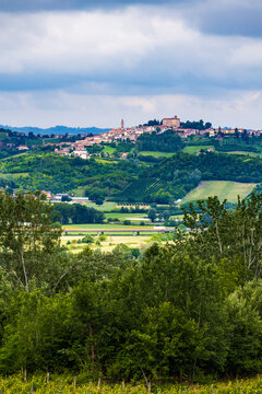 Village of Govone at the top of a hill in the Langhe region seen from Costigliole d'Asti