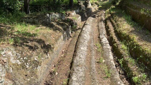 Ancient Etruscan Stone Street with Deep Wheel Grooves in Cerveteri Necropolis
