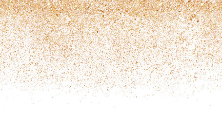 Falling golden sand particles isolated on a white background creating an abstract natural texture for summer or desert design templates