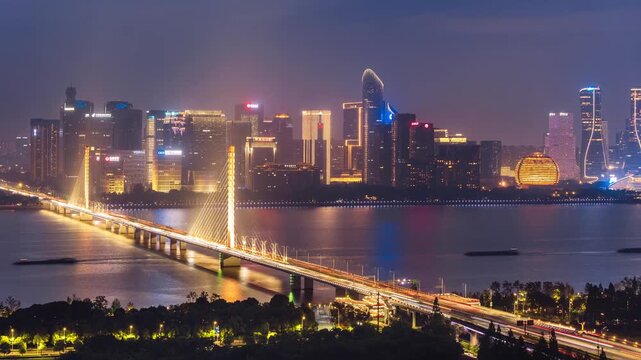 High angle timelapse of the Qianjiang Third Bridge and Qianjiang New District in Hangzhou, Zhejiang Province, China