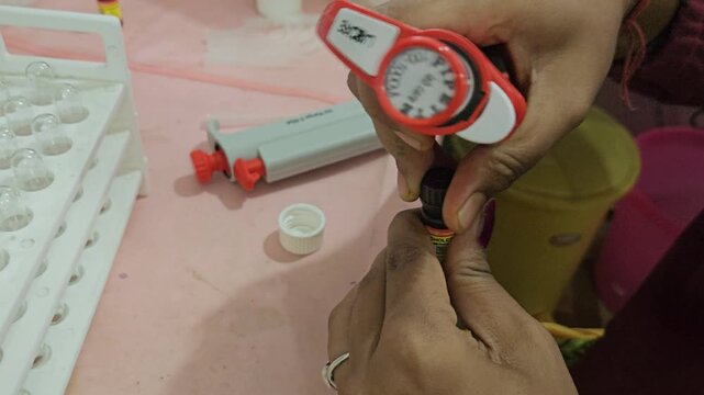 Micropipette Aspirating Laboratory Reagent from Bottle for Clinical Sample Analysis, Medical Laboratory Procedure, Scientific Research, Biotechnology, 4K Cinematic Footage