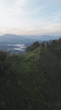 Aerial View of Misty Mountain Range at Sunrise