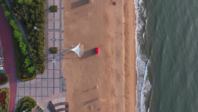 Aerial view of beach and plaza in Rizhao Shandong with sand shoreline and green landscaping