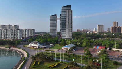 Obraz premium Modern urban architecture complex along the coastal area of Rizhao Shandong under clear morning sky
