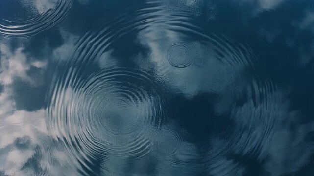 Aerial View of Blue Sky Reflection on Still Water with Expanding Ripples Peaceful Nature Background
