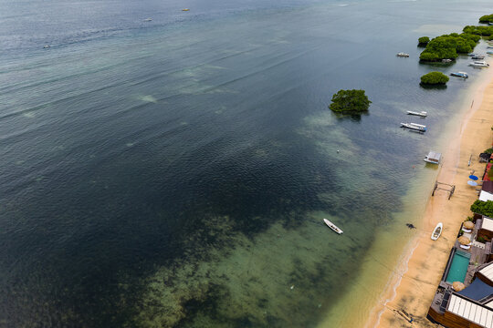 Aerial view of tropical beach and shallow reef in Nusa Lembongan, Indonesia