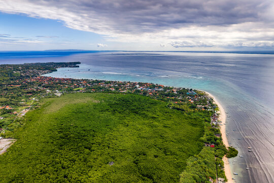 High angle drone view of tropical coastline and mangroves on Nusa Lembongan island