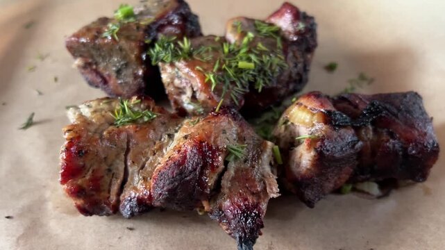 Delicious pork shashlik. Grilled meat, pieces with onions and dill. Caucasian barbecue.