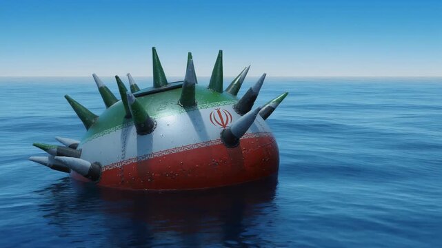 Close up of sea mine painted with Iranian flag floating on water at sea