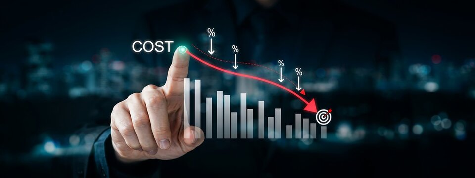 Businessman pointing to a decreasing cost graph with a red arrow and target