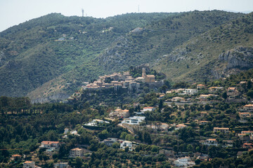 Fototapeta premium Panoramic view of the medieval hilltop village of Eze from Cap d'Ail on the French Riviera, France