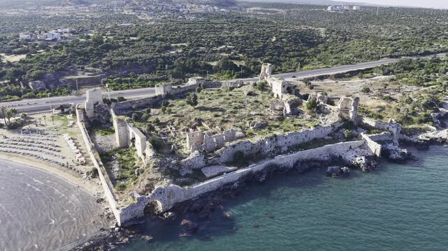Aerial Drone View of Korykos Castle and Mediterranean Coastline in Mersin, Turkey, Historic Fortress by the Sea at Sunset