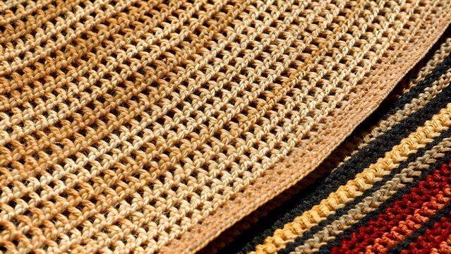 Beige woven straw straw hat texture background close up