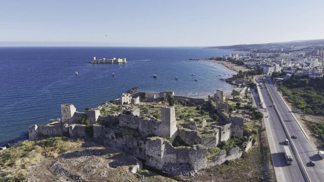 Aerial Drone View of Korykos Castle and Mediterranean Coastline in Mersin, Turkey, Historic Fortress by the Sea at Sunset
