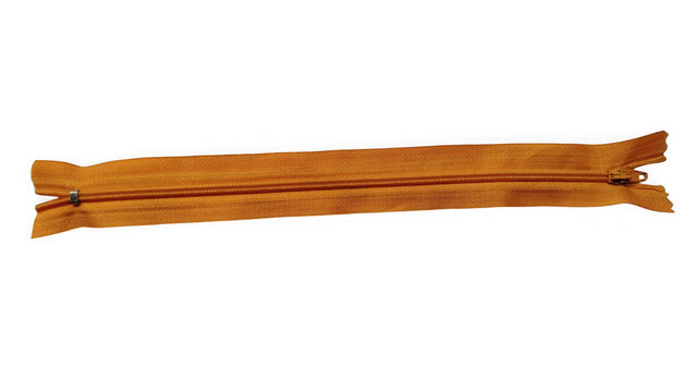 Orange metal zipper fastener for clothing and accessories isolated on plain surface isolated on transparent background