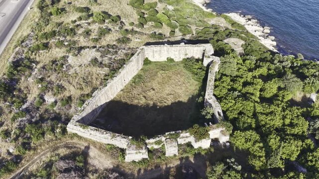 Aerial Drone View of Korykos Castle and Mediterranean Coastline in Mersin, Turkey, Historic Fortress by the Sea at Sunset