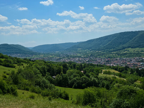 germany, breathtaking mountain panorama above dettingen an der erms revealing lush swabian alb valley with church and endless summer blue sky