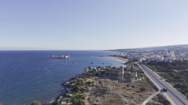 Aerial Drone View of Korykos Castle and Mediterranean Coastline in Mersin, Turkey, Historic Fortress by the Sea at Sunset