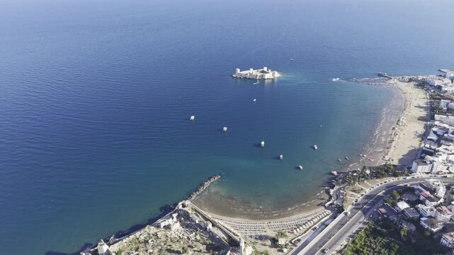 Aerial Drone View of Korykos Castle and Mediterranean Coastline in Mersin, Turkey, Historic Fortress by the Sea at Sunset