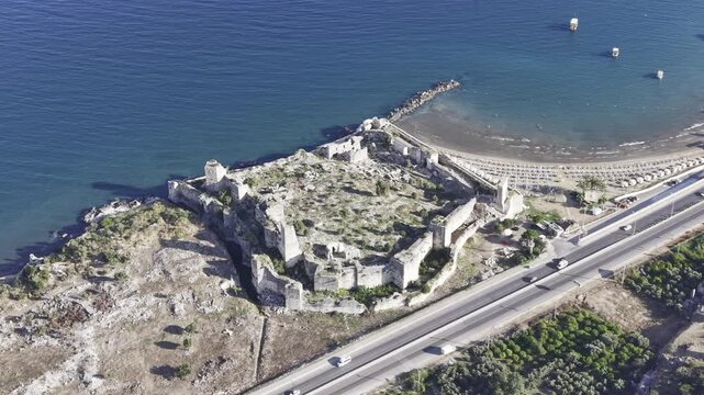 Aerial Drone View of Korykos Castle and Mediterranean Coastline in Mersin, Turkey, Historic Fortress by the Sea at Sunset
