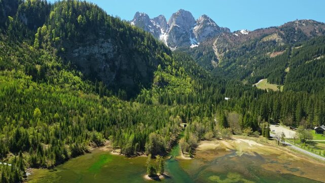 Aerial view of alpine valley with Gosau lake and green pine forests, Austria