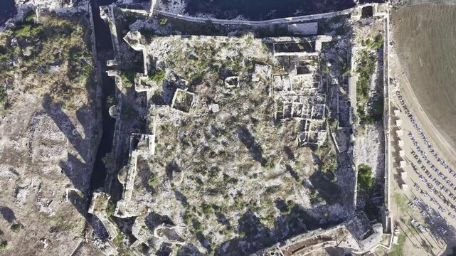 Aerial Drone View of Korykos Castle and Mediterranean Coastline in Mersin, Turkey, Historic Fortress by the Sea at Sunset
