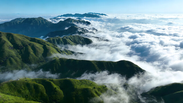 Green mountain ridges above white cloud sea under blue sky