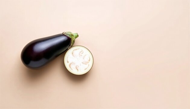 Fresh Eggplant on Warm Beige Background