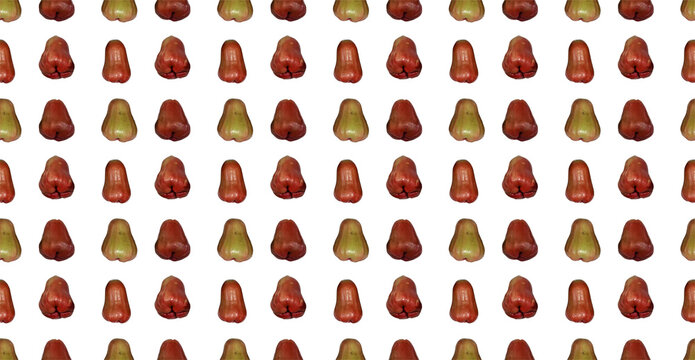 Photography of an orderly grid alignment seamless wallpaper pattern featuring rows of red and green wax apples or tropical jambu air fruits isolated on a plain white background template