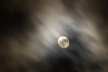 Full moon in the dark night sky with clouds,  © ric